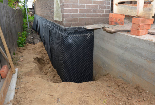 SJ Waterproofing Pros technician performing targeted Waterproofing assessment in Erie, IL